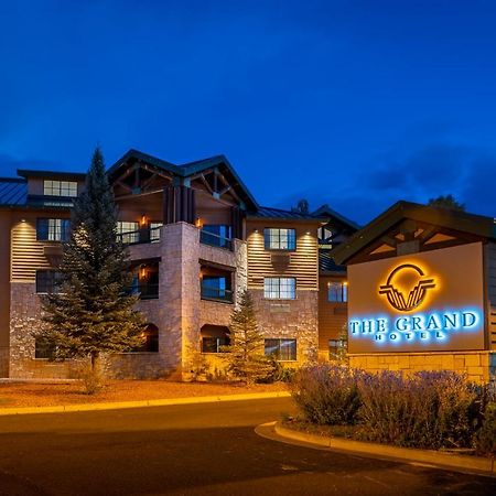 The Grand Hotel At The Grand Canyon Tusayan Εξωτερικό φωτογραφία The image shows a building featuring a sign that reads "The Grand." The structure appears to be a hotel or lodge, characterized by a combination of stone and wooden features. It is illuminated with warm lighting, which creates an inviting atmosphere.
