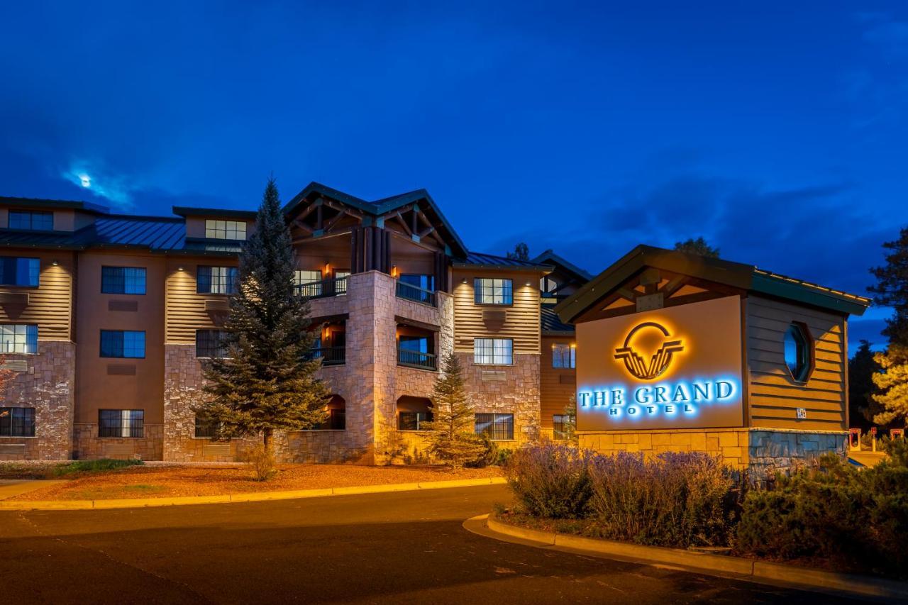 The Grand Hotel At The Grand Canyon Tusayan Εξωτερικό φωτογραφία The image shows a building featuring a sign that reads "The Grand." The structure appears to be a hotel or lodge, characterized by a combination of stone and wooden features. It is illuminated with warm lighting, which creates an inviting atmosphere.